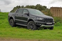 Ford Ranger Raptor long-term test review 2020 - front view, black parked on grass slope