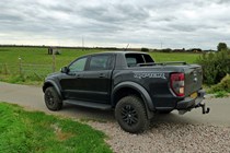 Ford Ranger Raptor long-term test review 2020 - rear side view, black, country road, gravel