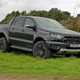 Ford Ranger Raptor long-term test review 2020 - front view, black parked on grass slope
