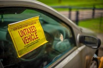 Untaxed vehicle notice on car window - Electric vehicle excise duty