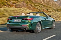 Green 2021 BMW 4 Series Convertible rear three-quarter driving