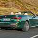 Green 2021 BMW 4 Series Convertible rear three-quarter driving