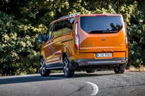Ford Tourneo Custom Active review, 2020, orange, rear view, driving round corner