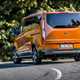 Ford Tourneo Custom Active review, 2020, orange, rear view, driving round corner