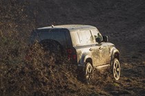 New Land Rover Defender off-roading with conviction