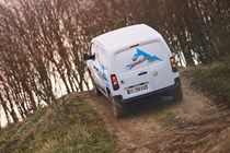 Vauxhall Combo Cargo 4x4 review, white, rear view, driving off-road up hill