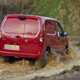 Vauxhall Combo Cargo 4x4 review, red, rear view, splashing through muddy water