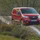 Vauxhall Combo Cargo 4x4 review, red, front view, driving along muddy track