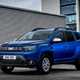 Best car-derived vans 2024: Dacia Duster Commercial, front three quarter static, blue paint