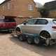 Best pickup UK group test: SsangYong Musso, towing car on trailer