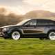 Best luxury SUVs - Bentley Bentayga, black, side view, driving