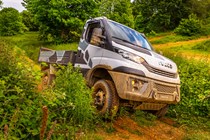 Iveco Daily 4x4 Off-Road chassis cab, white, front view, crashing through bush