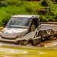 Iveco Daily 4x4 Off-Road chassis cab, white, front view, wading through deep water