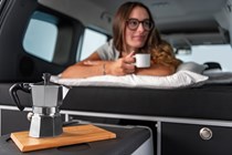 Mercedes-Benz Citan campervan, happy camper in bed with coffee