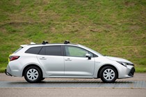 Toyota Corolla Commercial Hybrid van, side view, silver, roof rack, blacked out rear windows