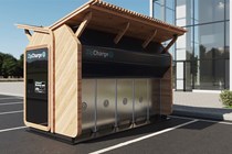 A parking space is dominated by a set of futuristic lockers housing portable EV charging devices