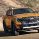 New Ford Ranger - Wildtrak driving off-road, yellow