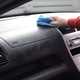 Cleaning the dashboard of a car
