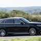 Mercedes GLC (2023) review: side view driving, black car, rural B-road