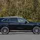 Mercedes GLC (2023) review: side view static, black car, trees in background
