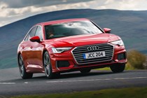 Audi A6 Saloon (2018-) UK rhd model in red, front three-quarters driving