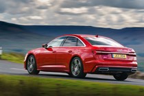 Audi A6 Saloon (2018-) UK rhd model in red, rear three-quarters driving