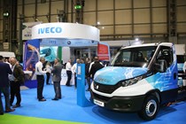 Iveco eDaily chassis cab on CV Show stand, surrounded by show-goers