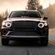 Bentley Bentayga EWB review - dead-on front view, purple, driving
