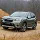 Subaru Forester (2022) review - front three quarter, green car, driving up a dirt road