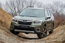 Subaru Forester (2022) review - front static, parked between two hills on an off-road course