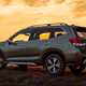 Subaru Forester (2022) review - rear three quarter static, green car, sunset background