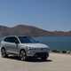 Volvo EX90 review: front three quarter static, grey paint, lake in background