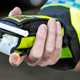 When can I drive after drinking?: a police officer holding a breathalyser