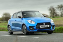 Suzuki Swift Sport (2023) review: front cornering shot, blue car, British B-road