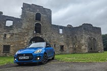 Suzuki Swift Sport long termer parked in front of Curwen Castle in Workington, blue car