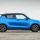 Suzuki Swift Sport (2023) review: side view static, blue car, wood in background