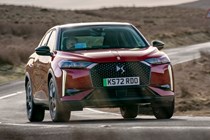 DS 3 E-Tense (2023) review: front three quarter cornering, red car, parched background