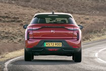 DS 3 E-Tense (2023) review: rear cornering square on, red car, parched background