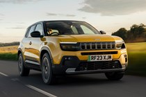 Jeep Avenger (2023) review: front three quarter driving, yellow paint, sunset