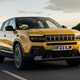 Jeep Avenger (2023) review: front three quarter driving, yellow paint, sunset