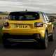 Jeep Avenger (2023) review: rear three quarter driving, yellow paint, rural road