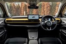 Jeep Avenger (2023) review: dashboard and infotainment system, black upholstery, yellow dashboard panel