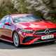 Mercedes A-Class Saloon, front three quarter tracking, red paint, wooded background