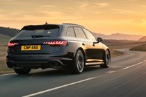 Audi RS4 Avant review, Competition, black, rear, driving at sunset