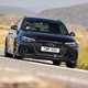 Audi RS4 Avant review, Competition, black, front, driving round corner