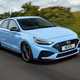 2023 Hyundai i30 N hatchback driving on a straight road. Photo taken from a tracking car..