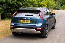 Kia Niro Plug-in Hybrid, rear three quarter driving, blue paint