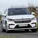 Skoda Enyaq Coupe (2024) review: front three quarter cornering, white paint, British country road
