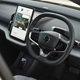 Volvo EX30 review (2024): infotainment system and steering wheel, black upholstery