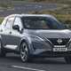 Best self-charging hybrids: Nissan Qashqai front three quarter driving, British roads, grey paint